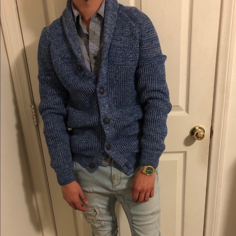 Blue cardigan.